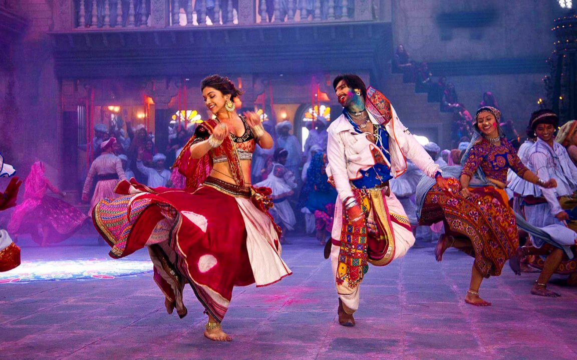 Bollywood dancers performing energetic dance routine